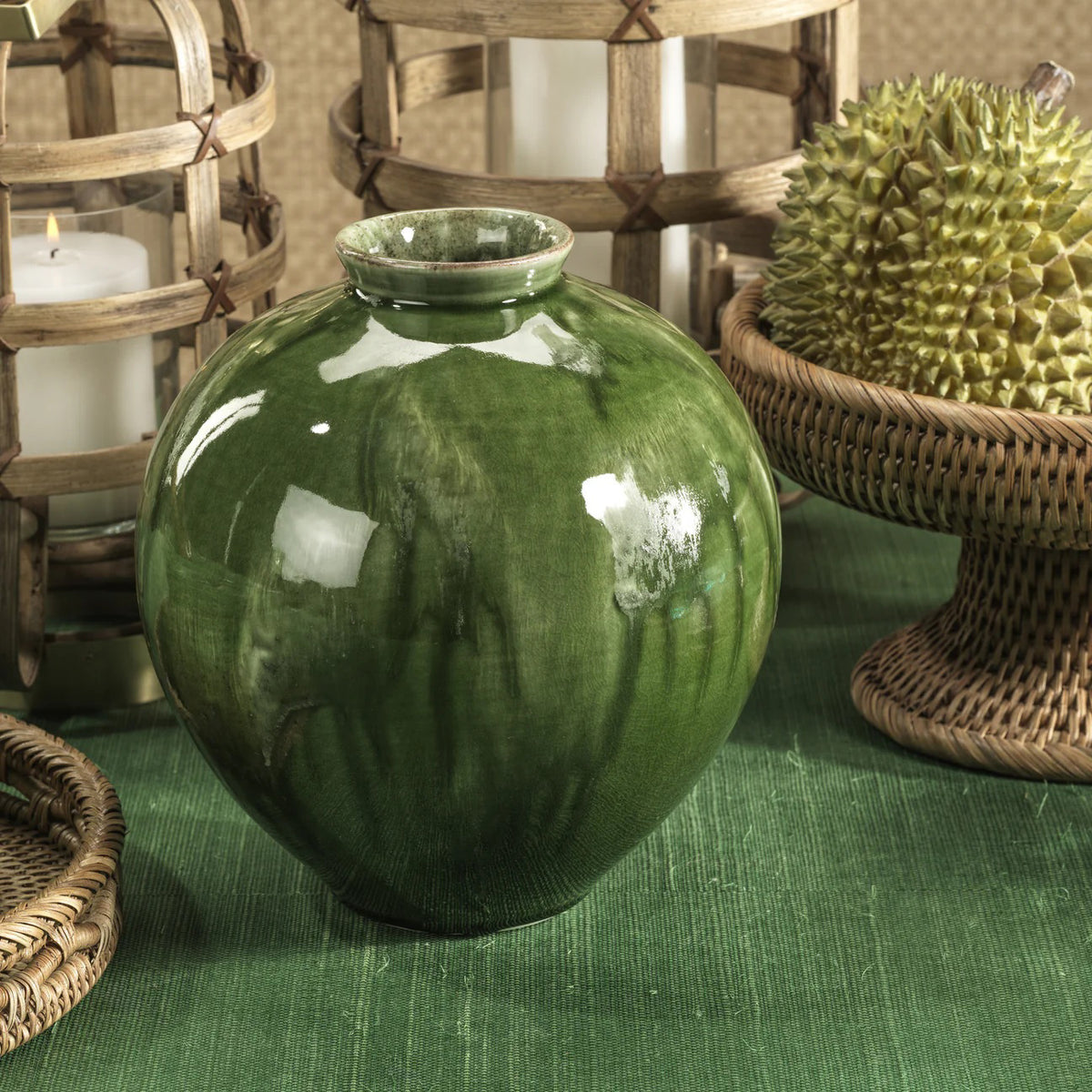 The ZODAX BLUBUS Glazed Ceramic Vase is a round, glossy green piece with a small opening and subtle glaze variations, measuring 9 x 10 inches and shown against a white background.