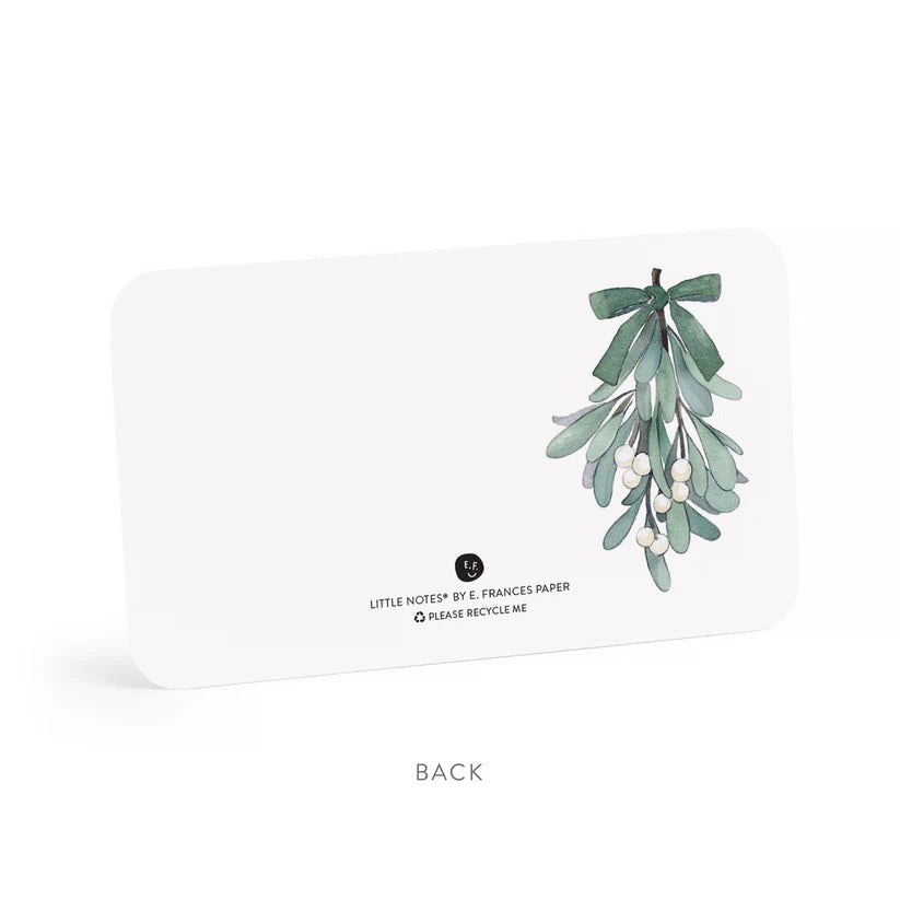 A clear plastic box contains 85 MISTLETOE LITTLE NOTES by E.FRANCES PAPER. The featured card displays a watercolor illustration of mistletoe with green leaves and white berries, beautifully tied with a pink bow. The label states &quot;E. Frances, 85 MISTLETOE LITTLE NOTES, use unsparingly.