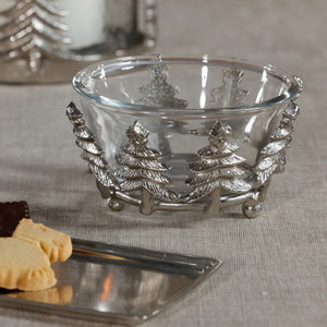 ZODAX GLASS AND ALLOR BOWL: a 5.5 in x 3 in clear glass bowl set in a silver-toned aluminum base featuring a decorative row of evergreen trees.