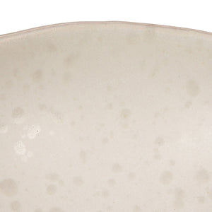 A close-up of the CREATIVE COOP WHITE SPECKLED BIRD-SHAPED STONEWARE FOOTED BOWL, featuring a gull-inspired design with a long beak and a smooth beige and light brown reactive glaze.