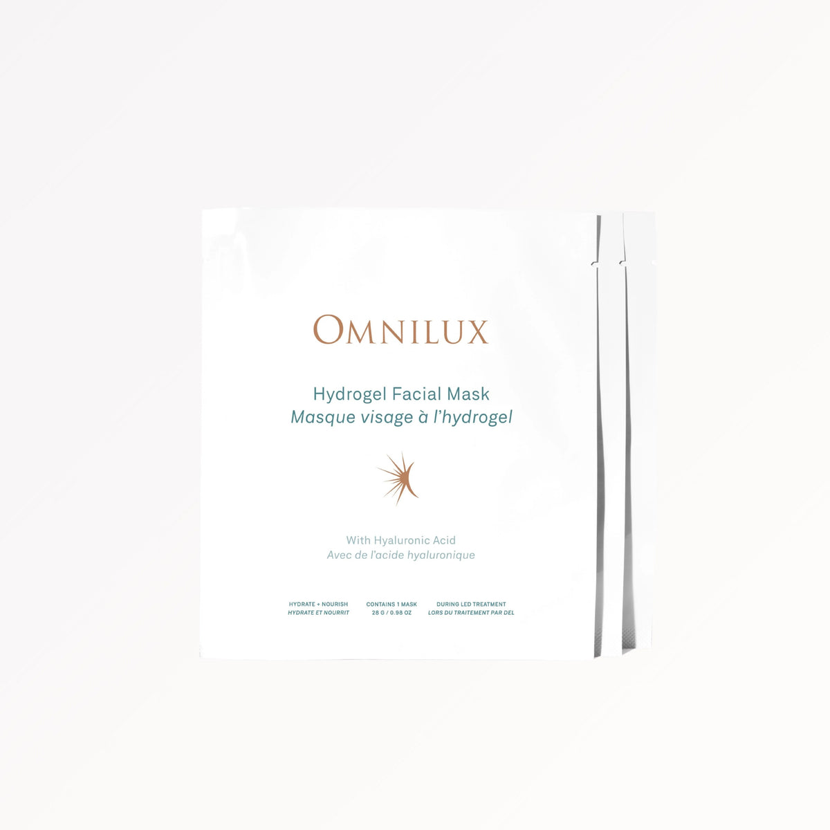 A woman removes an OMNILUX - HYDROGEL FACIAL MASK infused with Hyaluronic Acid from her face. Text above reads, “Includes 3 Hydrogel Facial Masks by OMNILUX.”.
