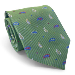 The BIRD DOG BAY PETER-BLAIR Bespoke Paisley Soiree Silk Tie in green features a small paisley pattern in blue, white, and red with colorful dots, handmade and shown rolled up on a white background.