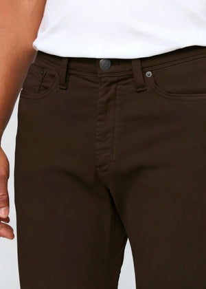 DU/ER - NO SWEAT STRAIGHT PANTS IN STOUT by DUER: Straight-leg, dark brown pants made from No Sweat fabric with front and back pockets, belt loops, and a button closure, shown on a white background.