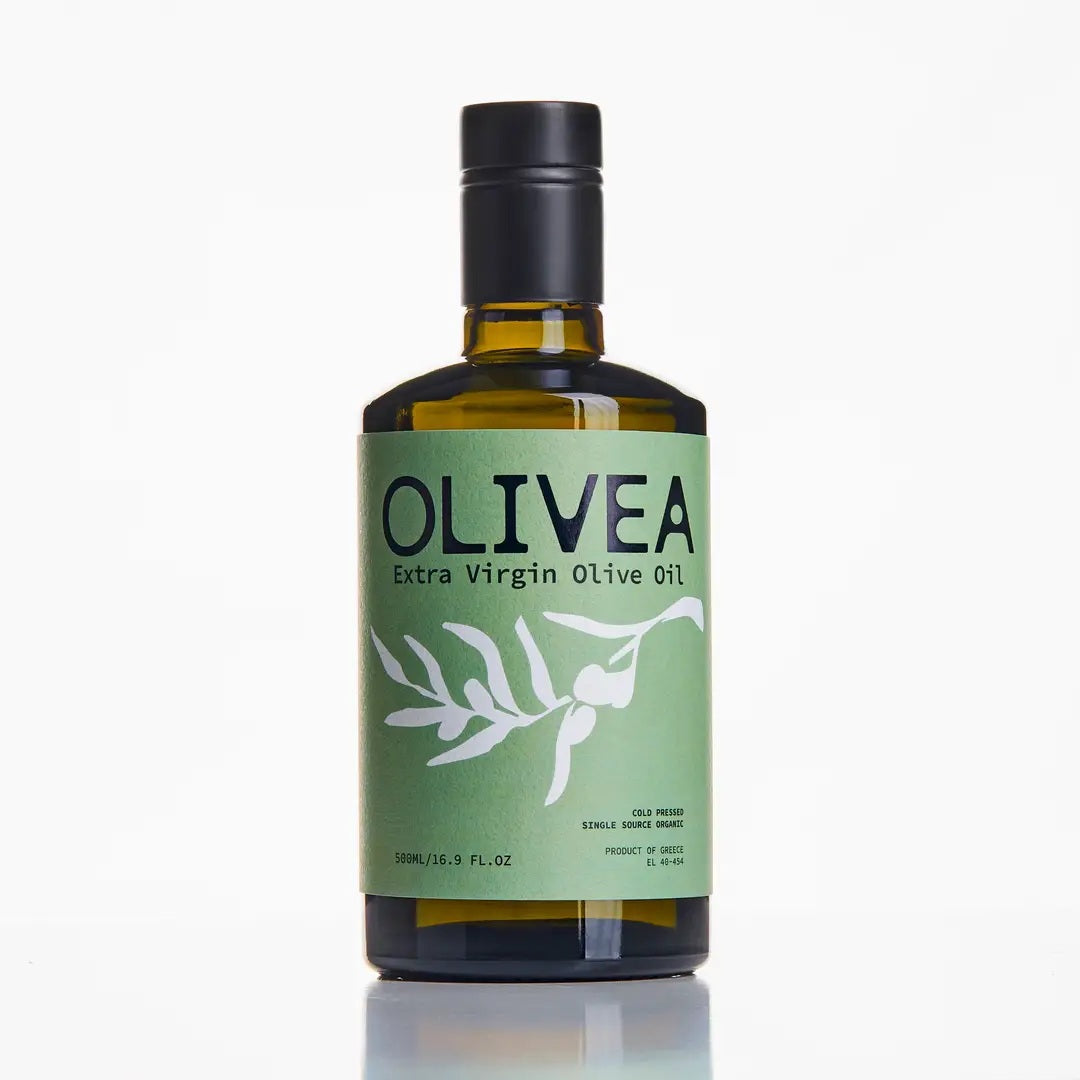 A bottle of OLIVEA - EVERYDAY HIGH PHENOLIC EXTRA VIRGIN OLIVE OIL, crafted from Greek olives and featuring a green label adorned with an olive branch illustration, is set against a plain white background. This USDA Certified Organic product from OLIVEA ensures purity and exceptional flavor in every drop.