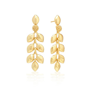 The CAPUCINE DE WULF Laurel Dangle Earrings feature textured leaf-shaped drops with a cluster of round beads on top, crafted from 18K gold over brass and shown against a white background.