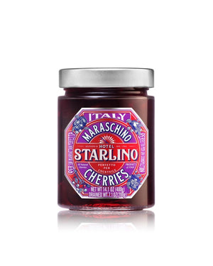 A jar of STARLINO ITALIAN MARASCHINO CHERRIES from the HOTEL STARLINO ITALIAN MARASCHINO brand features a vibrant red label adorned with intricate designs and proudly declares its Italian origin. Weighing 14.1 oz (400g), these luxury Maraschino cherries make an exquisite cocktail garnish.
