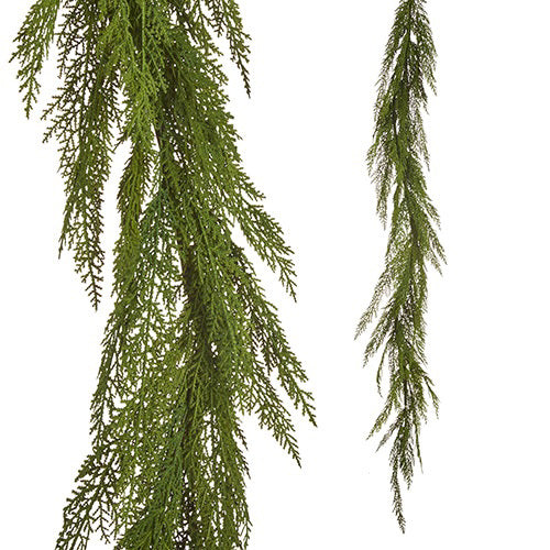 The NATURAL CEDAR GARLAND 5.5&#39; by RAZ IMPORTS features two strands of lush, green foliage hanging gracefully against a white background. The finely textured leaves offer a delicate and natural appearance, crafted from high-quality nylon to maintain vibrant charm effortlessly.