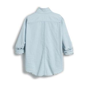 The FRANK & EILEEN LUKE Men's Button Up Shirt in Famous Denim Classic Denim Tattered Wash is shown from the back, with long sleeves, buttoned cuffs, a curved hem, and an oversized relaxed fit for a casual look.