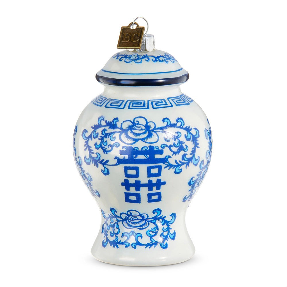 The GINGER JAR ORNAMENT by RAZ IMPORTS features blue and white floral patterns and Chinese characters, topped with a metal cap and hanging loop. Measures 2.5&quot; diameter and 4&quot; high.