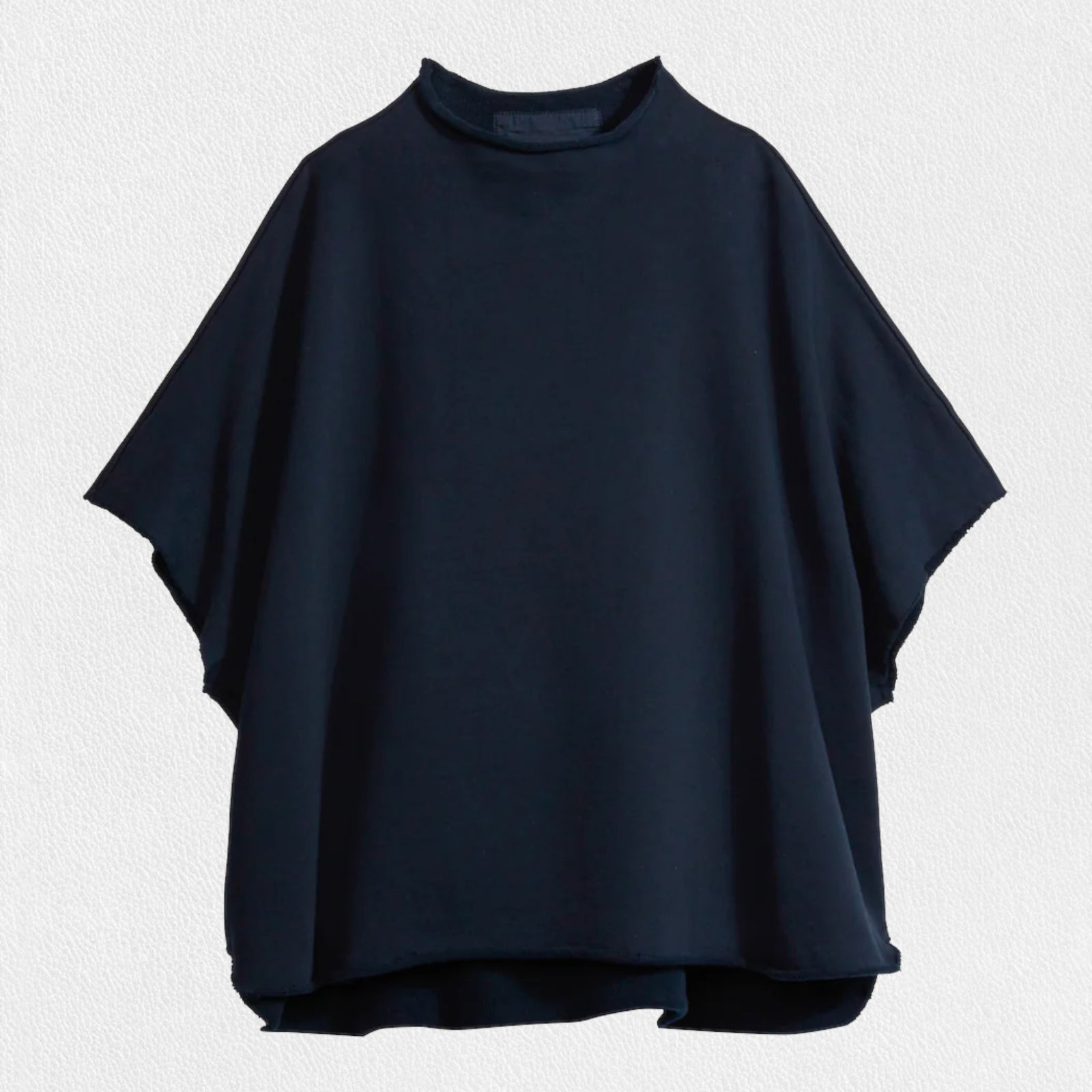 The FRANK & EILEEN Audrey Funnel Neck Capelet in British Royal Navy is a simple, loose-fitting dark navy blue t-shirt. Made from 100% cotton fleece, it features a high neckline and short sleeves with a boxy, relaxed silhouette against a white background.