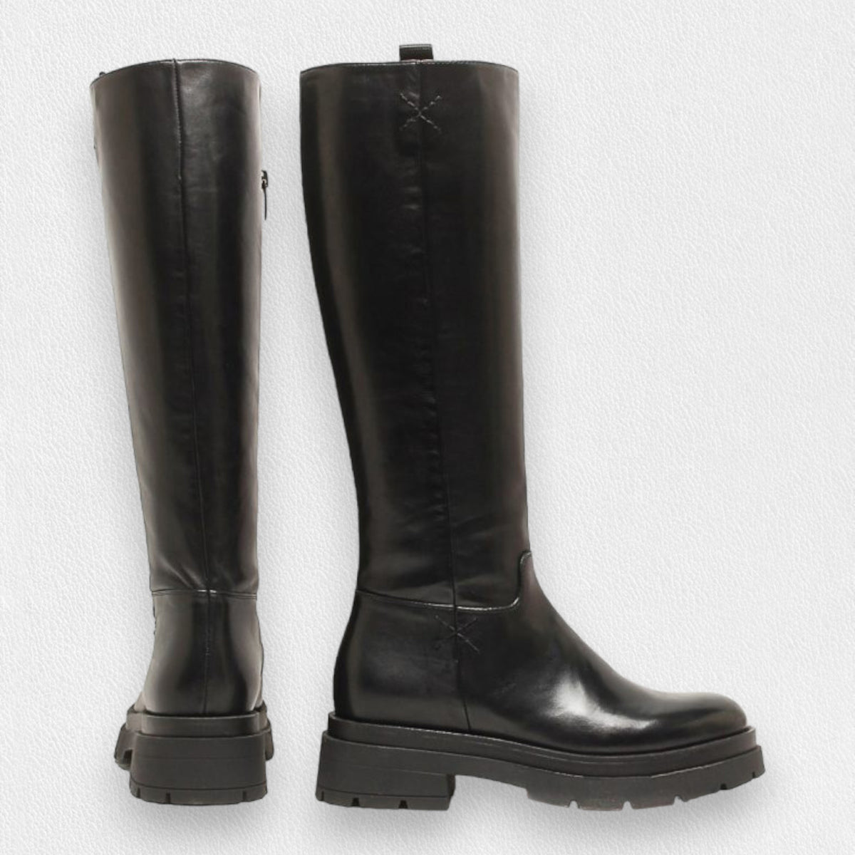 The MICHELE LOPRIORE TALL LEATHER BOOT, crafted in Italy, features chunky rubber soles and low block heels. Shown in black leather from the side and back on a white background.