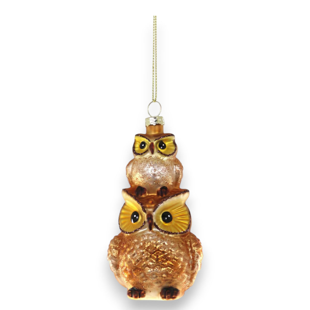 The STACKED OWLS ORNAMENT by CODY FOSTER features two brown and gold owls with large yellow eyes, stacked atop each other with a gold hanging string—an ideal holiday decoration for collectors or design lovers.