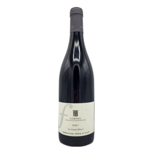 A bottle of FERRATON ‘LES GRANDS MURIERS’ CORNAS 2021 from WINE: 3 KEYS, an esteemed Northern Rhône Syrah, featuring a cream label and black capsule, stands upright against a white background.