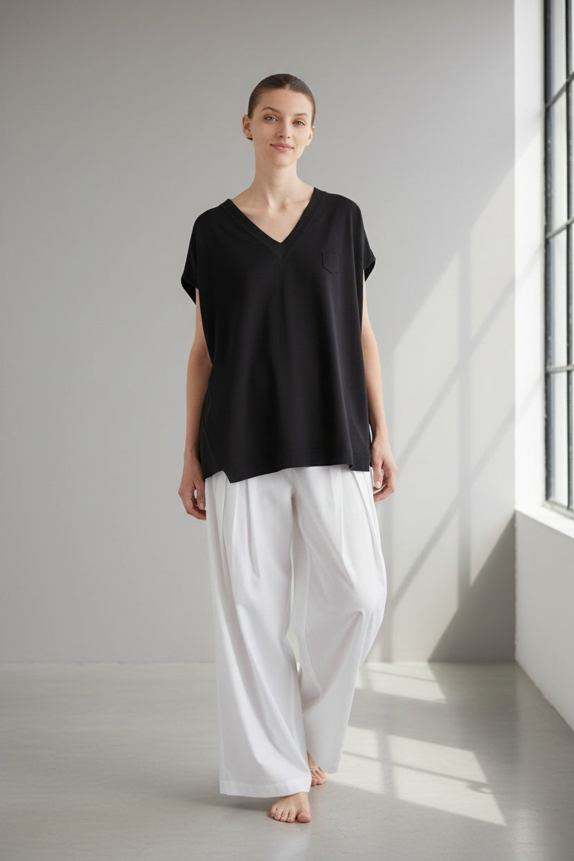 The MEIMEIJ Oversized Cotton T-Shirt in Black features a solid black, minimal design with a boxy silhouette—classic simplicity from the MEIMEIJ brand.
