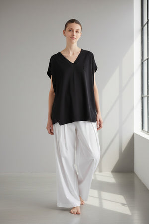 The MEIMEIJ Oversized Cotton T-Shirt in Black features a solid black, minimal design with a boxy silhouette—classic simplicity from the MEIMEIJ brand.