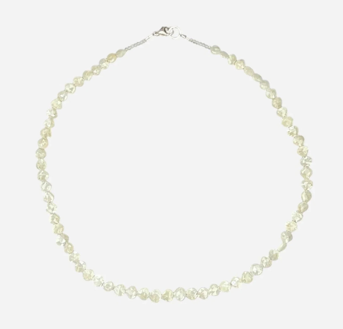 The ANN LIGHTFOOT Faceted Sillimanite and Quartz Ras du Cou Necklace features small, translucent pale yellow gemstones in an irregular single strand with a sterling silver clasp.