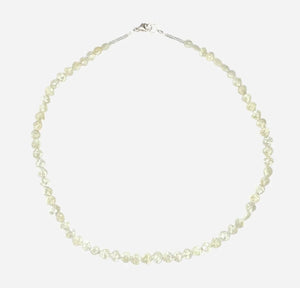 The ANN LIGHTFOOT Faceted Sillimanite and Quartz Ras du Cou Necklace features small, translucent pale yellow gemstones in an irregular single strand with a sterling silver clasp.