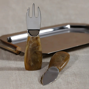 The ZODAX CHEESE SET WITH RESIN HANDLES includes two elegant cheese knives—one featuring a short flat blade and the other a two-pronged fork-shaped blade—each designed with wide, brown resin handles. Presented against a white background, this stylish set makes a practical addition to any gathering or a thoughtful hostess gift.