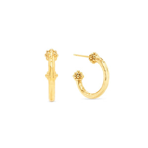 The CAPUCINE DE WULF - BERRY SLICE SMALL HOOP EARRINGS by CAPUCINE DE WULF feature a handmade design with small gold hoops, showcasing a textured hammered finish and decorative beaded clusters at the top and bottom of each hoop, displayed on a white background.
