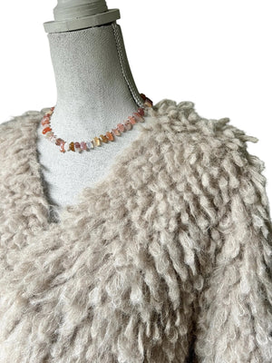 The ANN LIGHTFOOT - Swazi Red Agate Pebble Ras Du Cou Necklace features oval multicolored pink, orange, and light gray stones in a single strand with a sterling silver clasp.