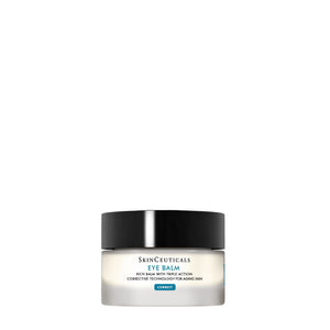A jar of SKINCEUTICALS - EYE BALM, a hydrating eye cream from SKIN CEUTICALS, with a hand applying it. Apply generously to clean fingertips and gently pat onto brow and under-eye area, avoiding eyelids.