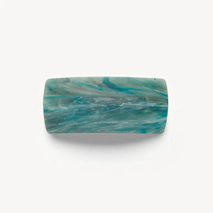 The MACHETE Jumbo Box Barrette in Jadeite is a rectangular hair clip made from Italian acetate with a marbled teal, blue, and white pattern—a bold accessory showcased on a plain white background.