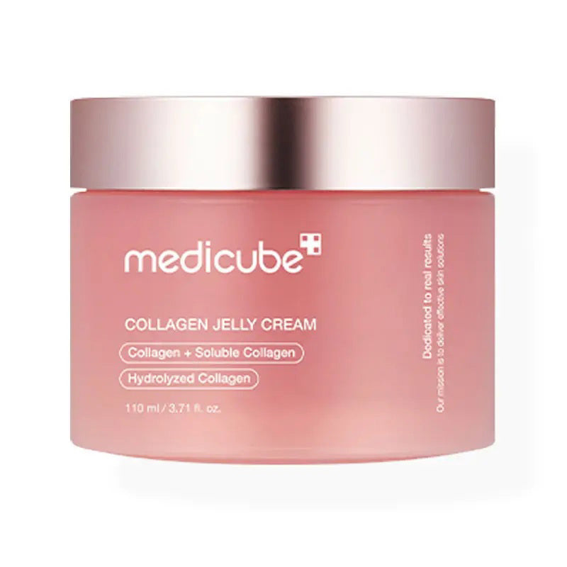 The MEDICUBE - COLLAGEN JELLY CREAM from ASIAN BEAUTY WHOLESALE features a pink gel-like texture with &quot;NO ARTIFICIAL COLORS&quot; and &quot;Enhanced with natural vitamin ingredients for a vibrant pink hue!&quot; on a light pink background. Experience Korean Glass Glow and enjoy its anti-aging benefits.