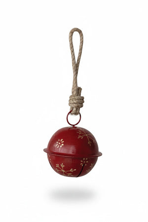 Creative Co-op JINGLE BELL ORNAMENT WITH SNOWFLAKES, a red spherical metal bell featuring gold snowflake designs, hanging from a rustic jute loop.