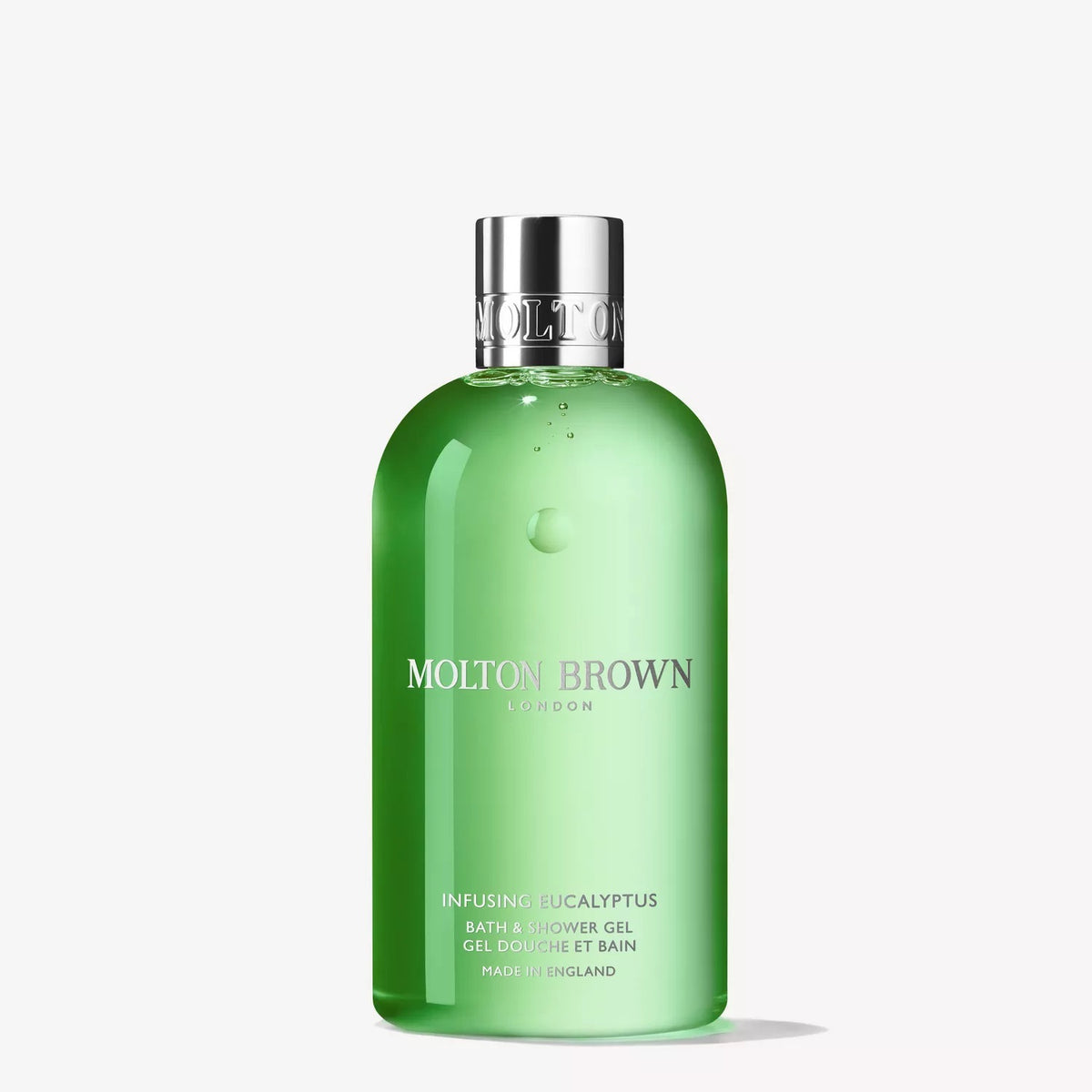 A green bottle of MOLTON BROWN Infusing Eucalyptus Bath and Shower Gel 300ml, with a silver cap and minimalist white text, sits against a plain white background. This refreshing gel revitalizes your senses with every use.