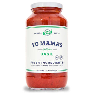 A jar of YO MAMA'S - BELLISIMA BASIL SAUCE from YO MAMA'S FOODS. The label emphasizes fresh ingredients, all-natural goodness, keto certification, no added sugar, and low sodium. Net weight: 25 oz (708 g).