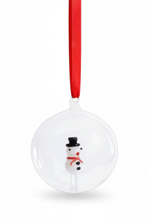 ZODAX SNOWMAN GLASS ORNAMENT: a clear 4-inch glass ball containing a small snowman figure, hung from a red ribbon.