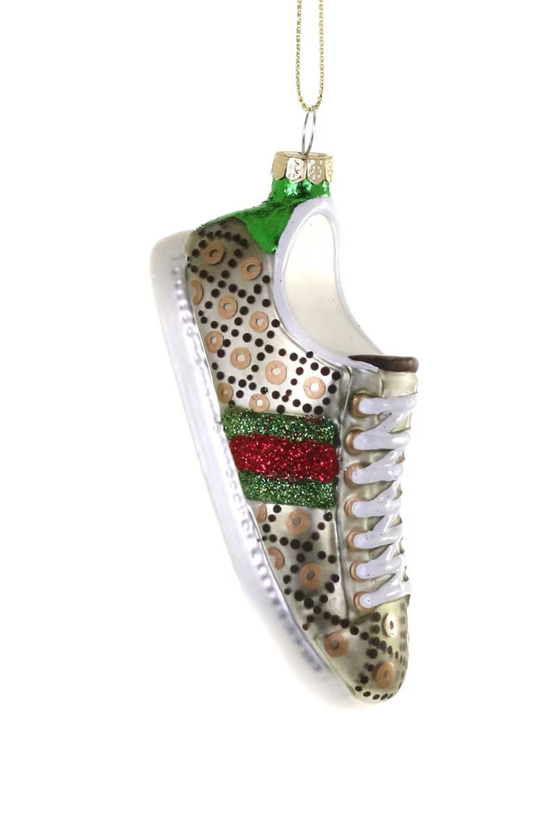 The CODY FOSTER LUXE SNEAKER ORNAMENT features a glass sneaker shape with gold polka dots, red and green glitter stripes, white laces, a gold cap with loop, and measures 4&quot; high by 1.5&quot; long, shown against a white background.