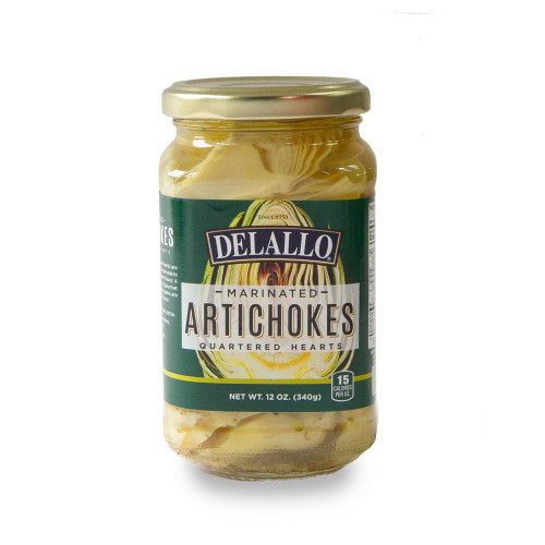 A 16oz jar of INTERNATIONAL GOURMET FOODS ARTICHOKE MARINATED ANTICA with a green and gold label and gold lid. These marinated artichoke hearts are a gourmet ingredient ideal for antipasto platters.