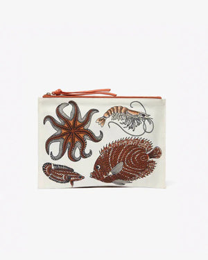 The INOUI EDITIONS Poseidon Pouch is a rectangular white bag by INOUI, made from durable cotton canvas with an orange zipper and decorated with colorful marine motifs like starfish, shrimp, pufferfish, and lionfish.
