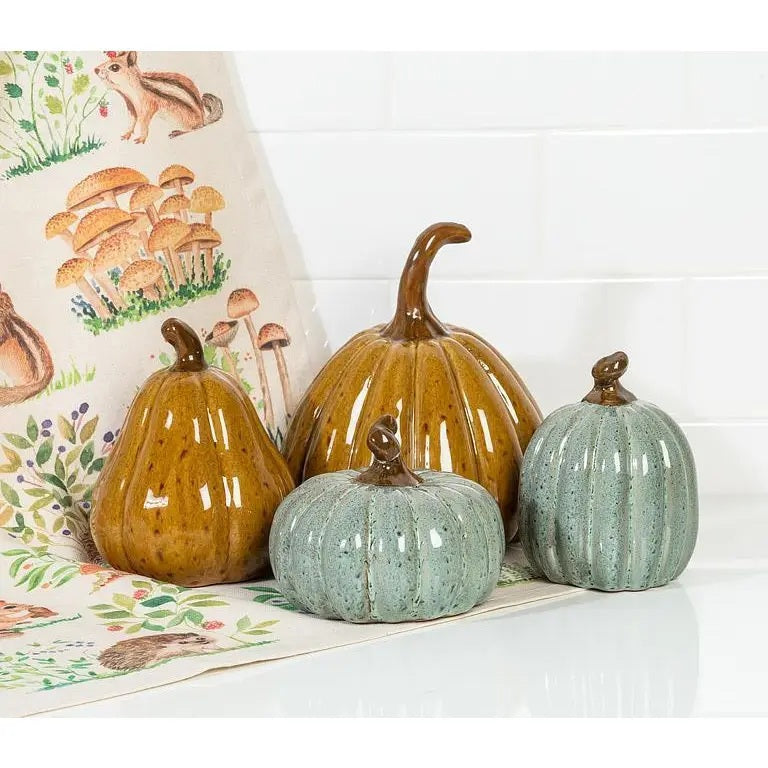 SMALL TALL CERAMIC PUMPKIN in a glossy brown ceramic with a dark brown stem and a dark gold glaze, perfect for autumn decor.