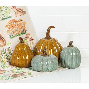 SMALL TALL CERAMIC PUMPKIN in a glossy brown ceramic with a dark brown stem and a dark gold glaze, perfect for autumn decor.