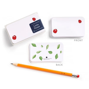 E. FRANCES PAPER's E. FRANCES - LITTLE NOTES LADYBUG features a rectangular stack of mini note cards with red flower accents on the front, green leaf pattern on the back, and comes packaged reading "Little Notes." Yellow pencil shown for scale.