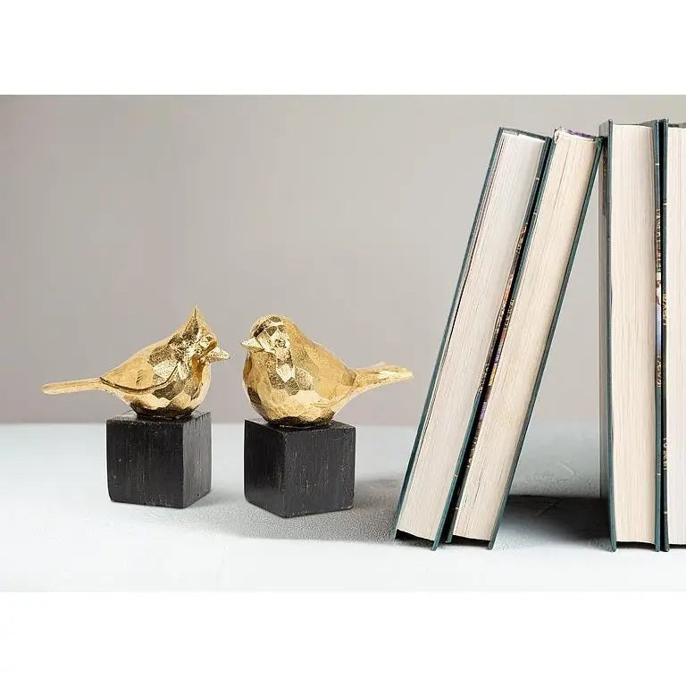 A golden SMALL CARDINAL CURIO figurine perched on a black square base, perfect for a display shelf.
