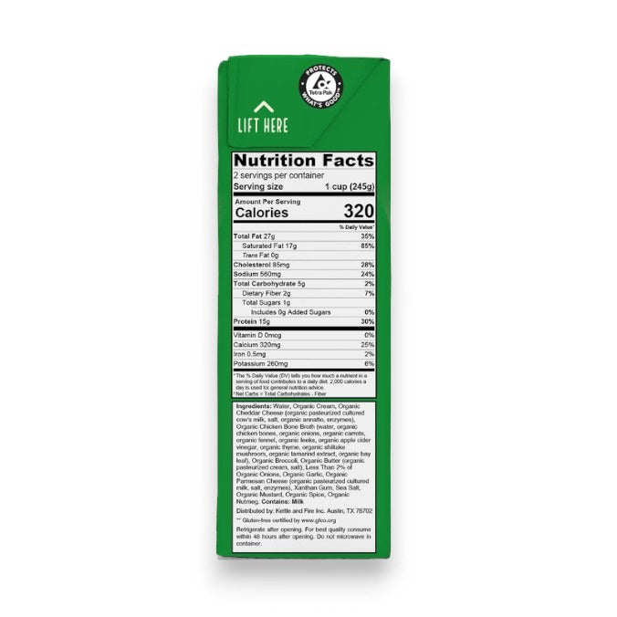 A 16.9-ounce (477g) carton of KETTLE &amp; FIRE - BROCCOLI CHEDDAR KETO SOUP, featuring organic broccoli and sharp cheddar. The front label highlights 15g of protein per serving, 3g net carbs, and chicken bone broth made from organic, free-range chicken bones. The package is white with green accents.
