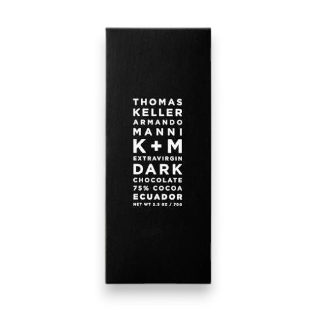 A sleek black box from K & M EXTRAVIRGIN CHOCOLATE features bold white lettering: K+M - EXTRAVIRGIN DARK ECUADOR BAR 75% COCOA NET WT 2.5 OZ / 70G. Crafted with Thomas Keller’s renowned expertise, this extravirgin dark chocolate bar showcases the rich and complex flavors of high-quality Ecuadorian cocoa.