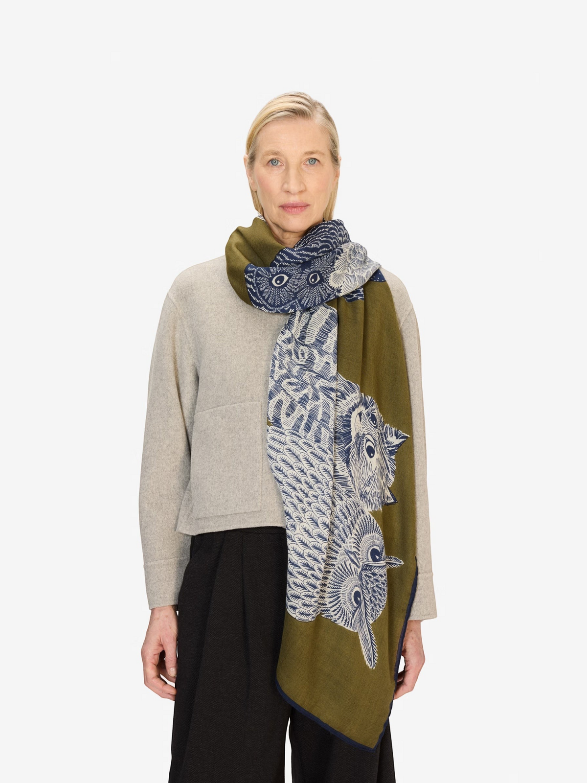 Fearrington Village INOUI EDITIONS olive green and blue wool scarf with owl print worn by a woman