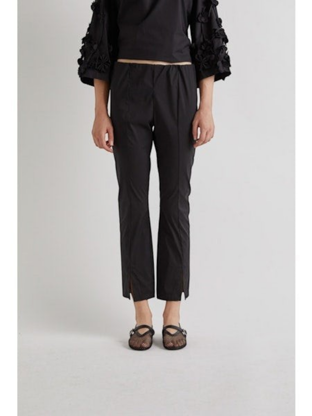 Fearrington Village MEIMEIJ black cotton cropped pants featuring a slim straight-leg fit and front hem slits
