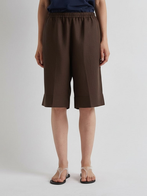 Fearrington Village MEIMEIJ mocha brown knee-length linen shorts with an elastic waistband and wide-leg fit.