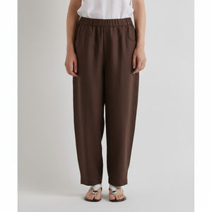A solid, dark mocha rectangle suggests the effortless comfort and minimalist style of MEIMEIJ’s Pull On Barrel Pants in Mocha—relaxed fit, elastic waistband, no visible objects or patterns.