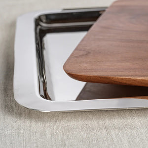 The ZODAX BRASSERIE STEEL & ACACIA FUSION BOARD features a square acacia wood tray with a metal border and an oval silver dish with a modern handle, making it the ideal large serving tray for any occasion.