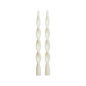 The ZODAX LUMIERE TWIST TAPER CANDLES—set of 2 in ivory, each 12 inches with a 6-hour burn time—stand upright side by side against a plain white background.