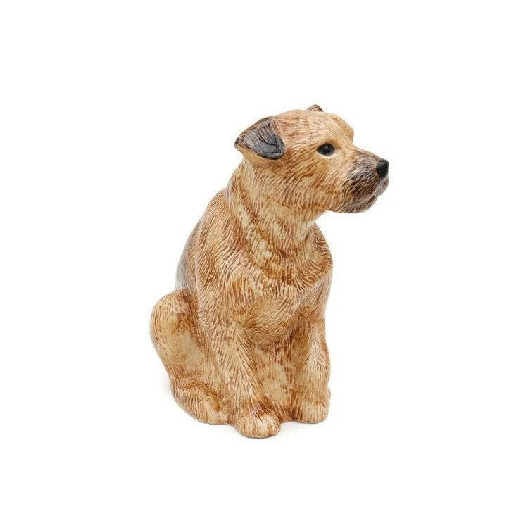The QUAIL CERAMICS - BORDER TERRIER FLOWER VASE by QUAIL DESIGNS is a hand-painted stoneware planter shaped like a brown dog with green plants as its hair, set against a plain white background.