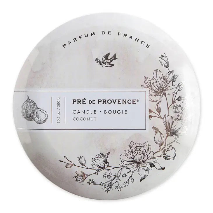 The &quot;3 Wick Candle - Coconut&quot; from European Soaps, LLC boasts an enchanting coconut and white gardenia scent in a circular tin adorned with black and white illustrations of flowers and a bird. The cover prominently displays &quot;PARFUM DE FRANCE,&quot; &quot;10.5 OZ / 300 G,&quot; and &quot;CANDLE • BOUGIE.