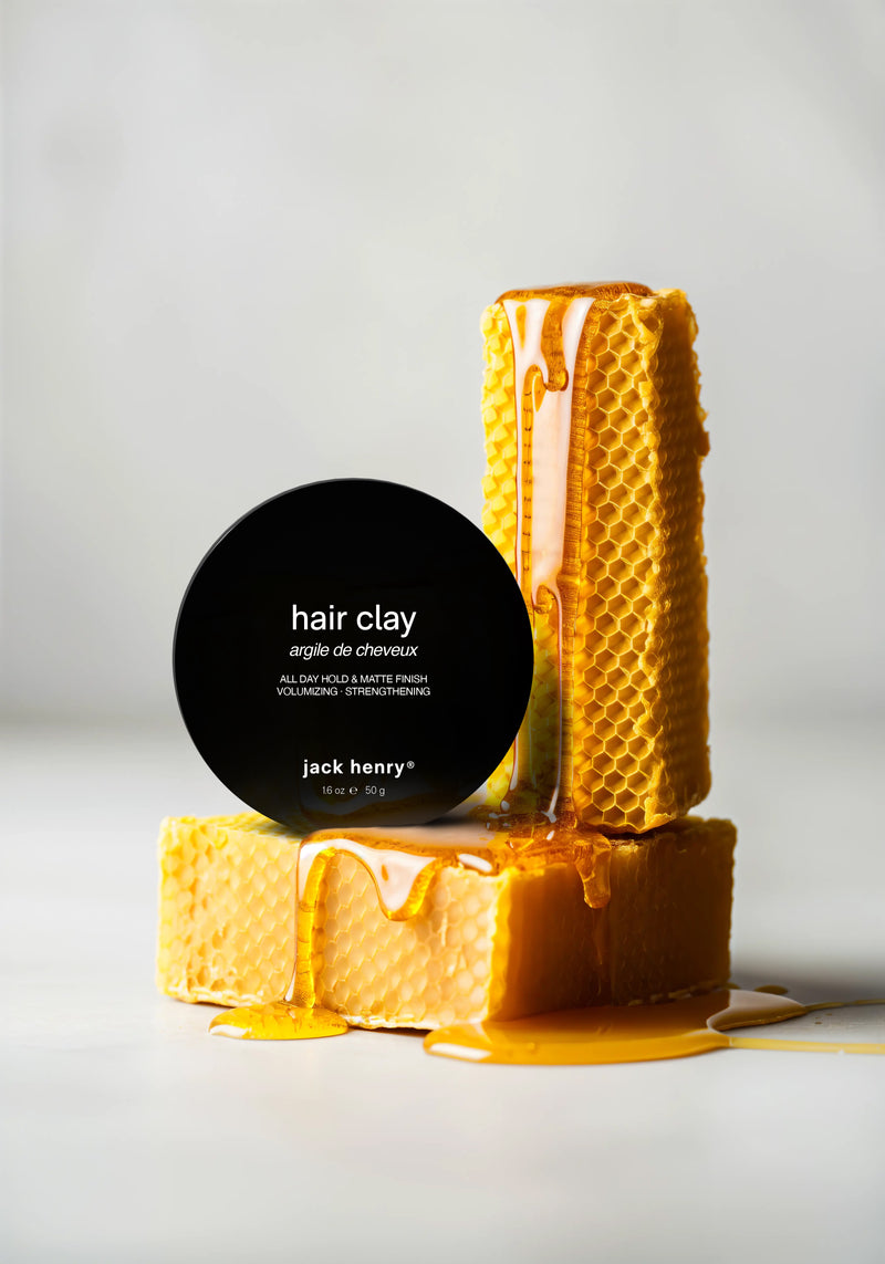 A round black container labeled 