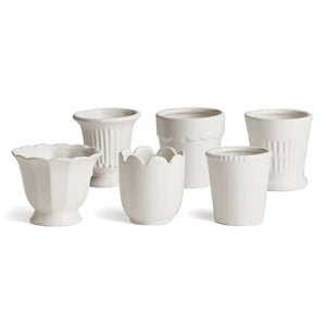 Six NAPA HOME AND GARDEN - MIRABELLE MINI CACHEPOTS, featuring classic design elements like scalloped edges and ribbed textures, are arranged on a plain white background.